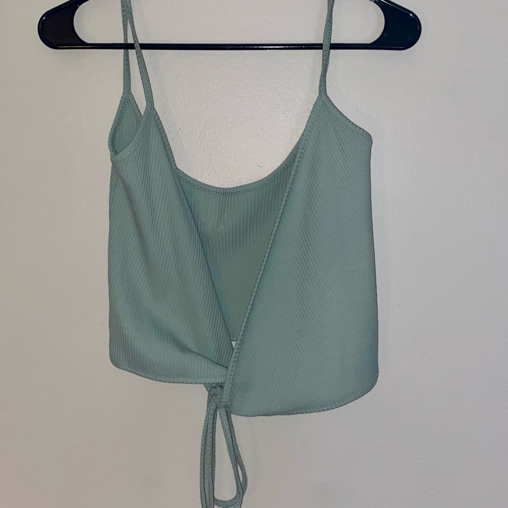 Size Small tank top from Shein. Wraps around the front and ties in the back.